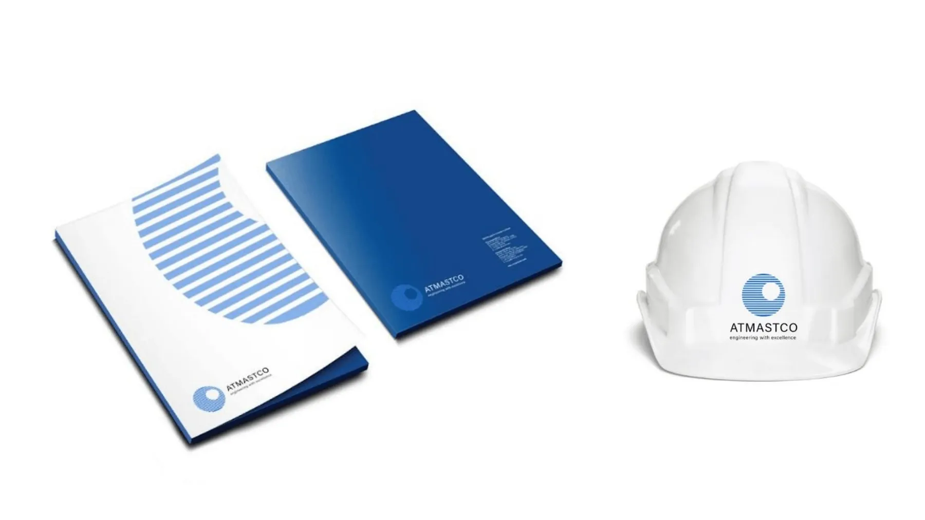 Presentation folders and a white safety helmet with the Atmastco logo