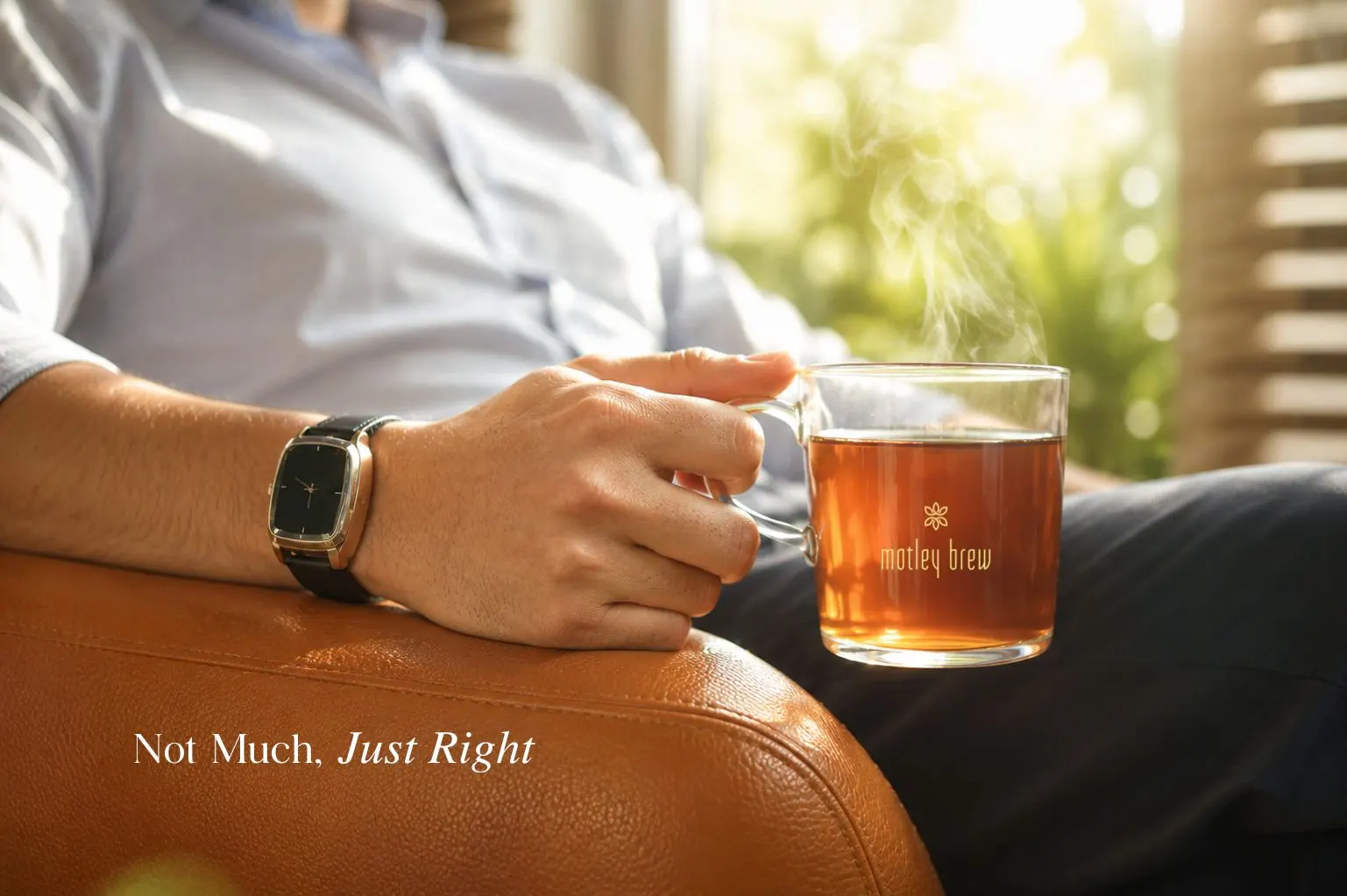Not Much, Just Right: a hand holding a glass of tea