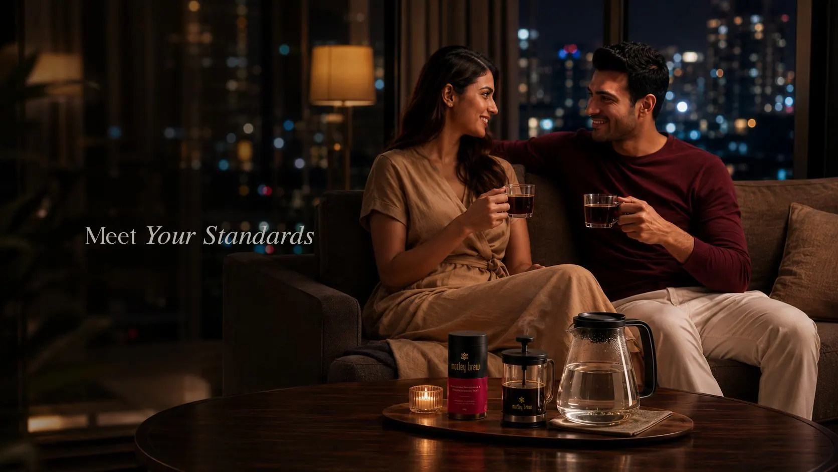 Meet Your Standards: a couple sharing tea on a sofa at night